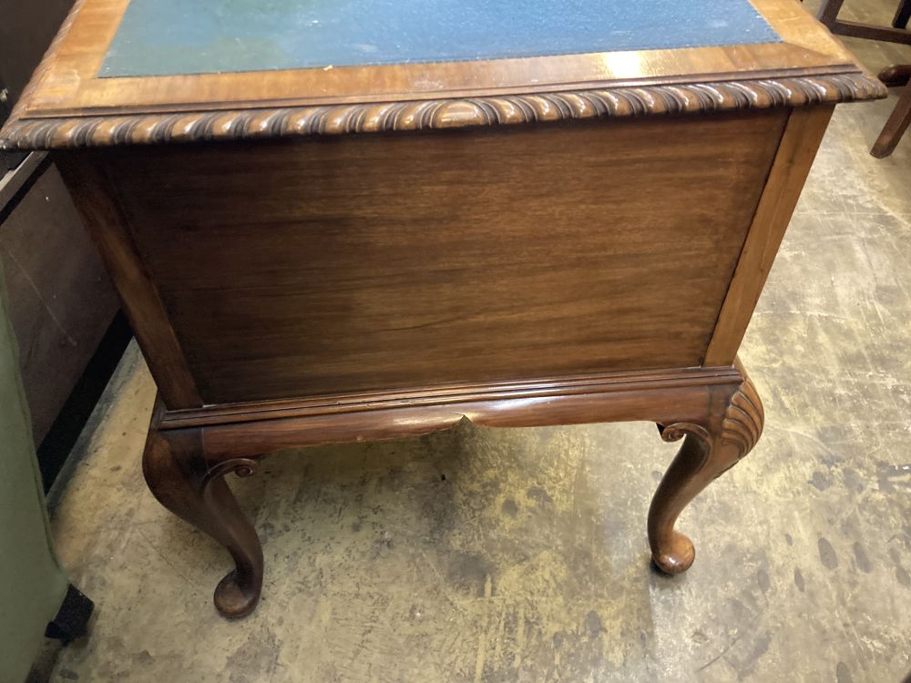 A Queen Anne Revival walnut kneehole desk, width 122cm, depth 62cm, height 75cm